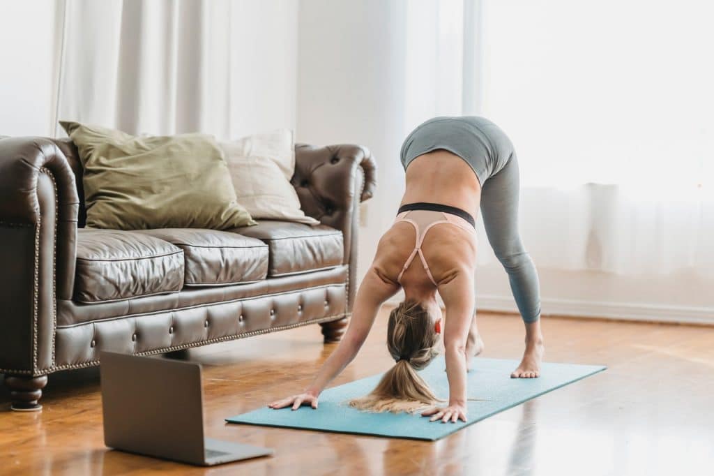 A woman doing 10-minute workout for stay at home parents
