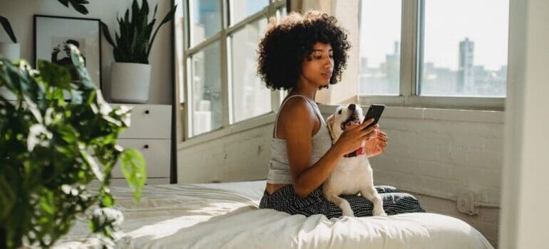 A woman watching videos on her phone.
