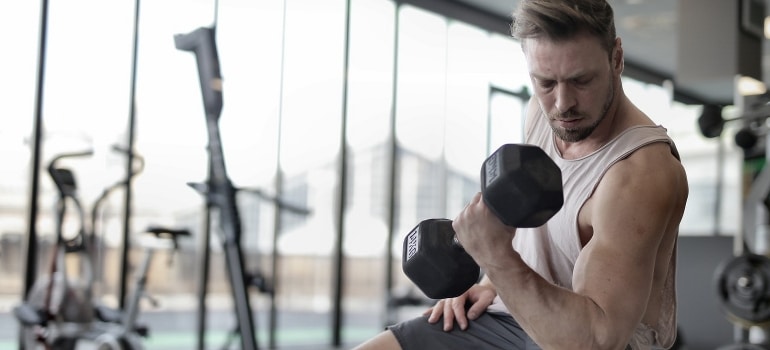 a man holding a dumbbell