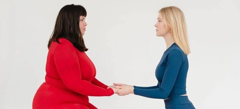 female bodybuilder personal trainer and a client