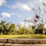 The woman practices karate