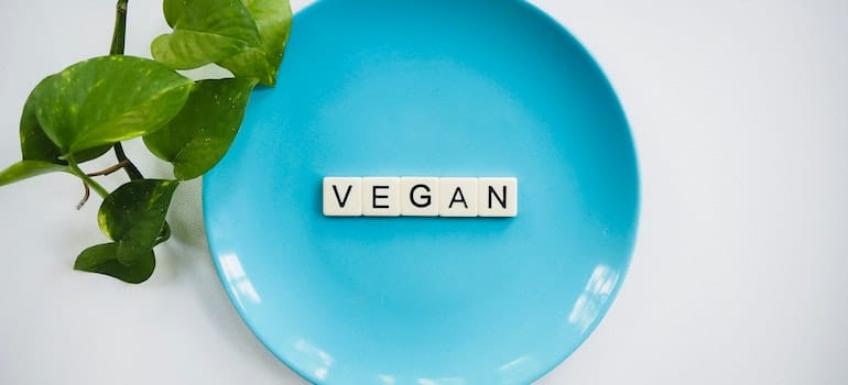 Vegan letters on a blue plate