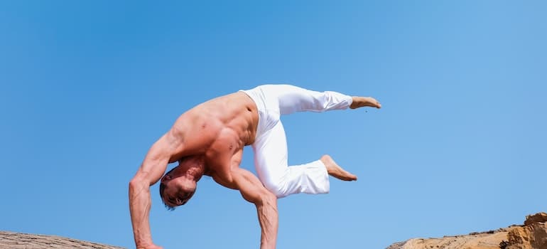 a man wearing white pants