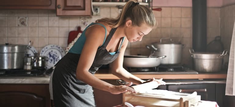 a young woman baking in the kitchen