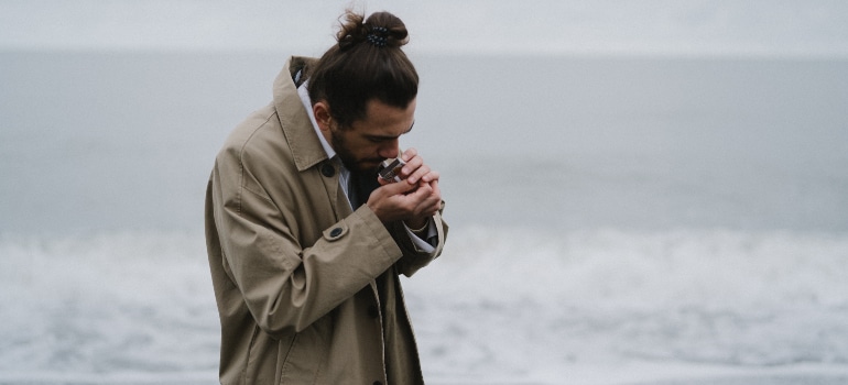 a man lighting a cigarette