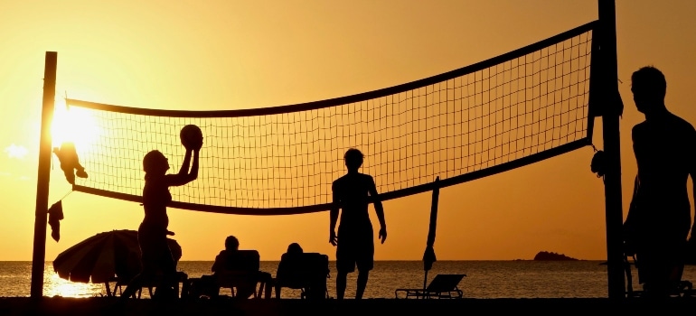 People playing beach volleyball