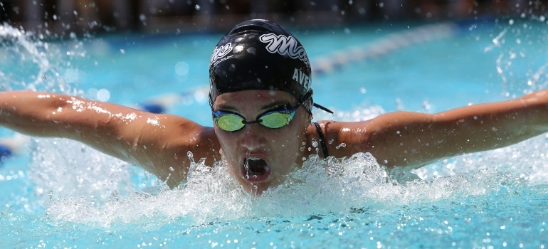 a person swimming thinking about the benefits of cross-training for long-distance runners