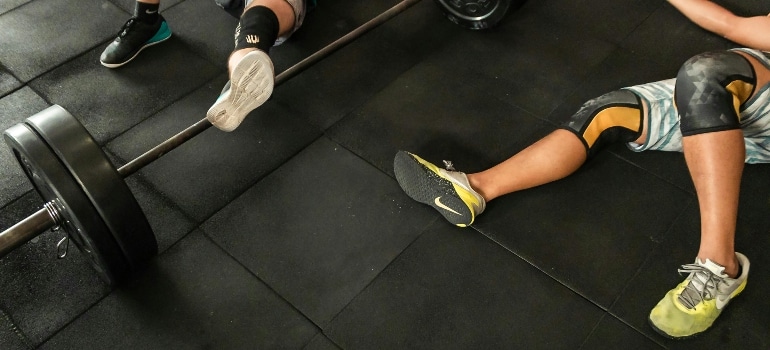 Men laying on the ground after a workout