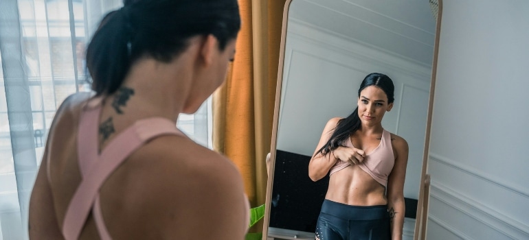 a woman looking at her reflection
