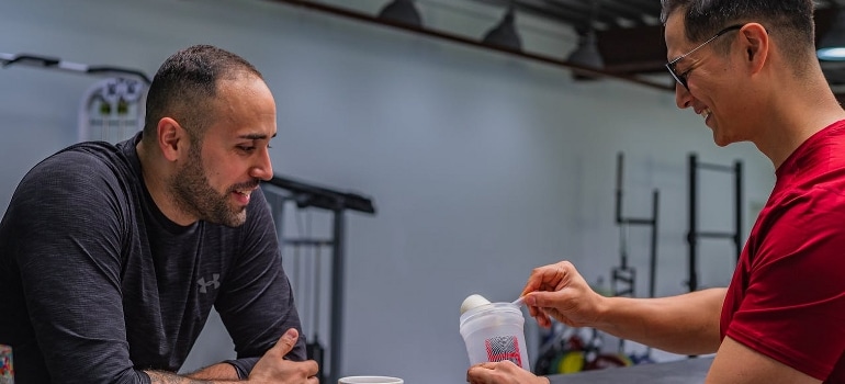 Sportsmen are preparing a protein shake