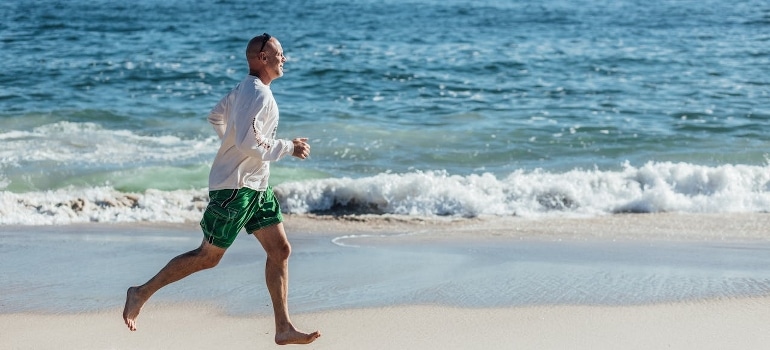 A man running on the beach.