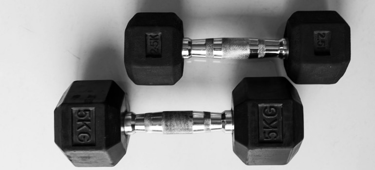 dumbbells on a white surface
