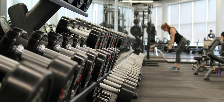 A woman exercising in one of the best hotels in Dubai with top-notch fitness facilities.