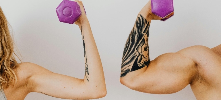 a couple flexing muscles