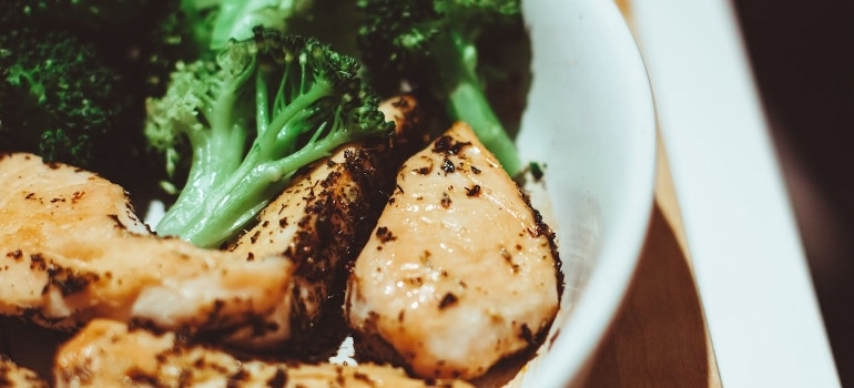 A chicken and broccoli meal in a bowl.