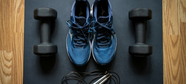 Home gym equipment sorted on the floor