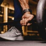 A football or basketball player lifting weights