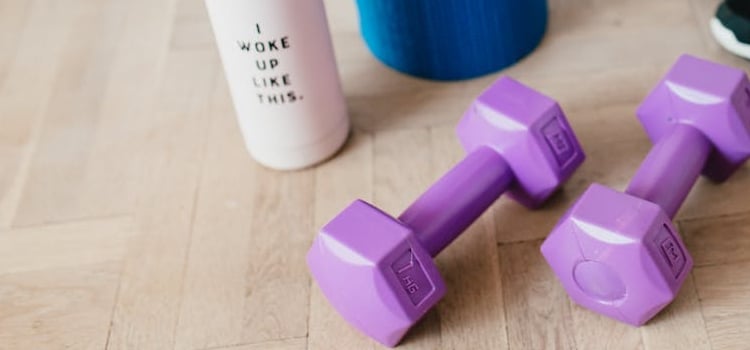 pink sport accessories and a workout bottle 
