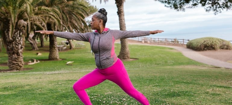 Woman doing balance exercises outdoors.
