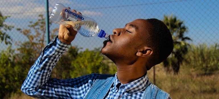 Man drinking water.