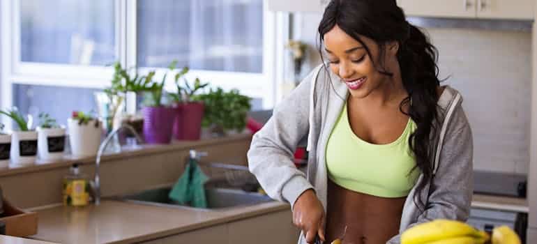 A woman cutting fruit