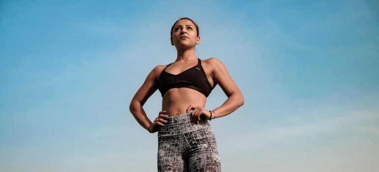 A fit woman standing