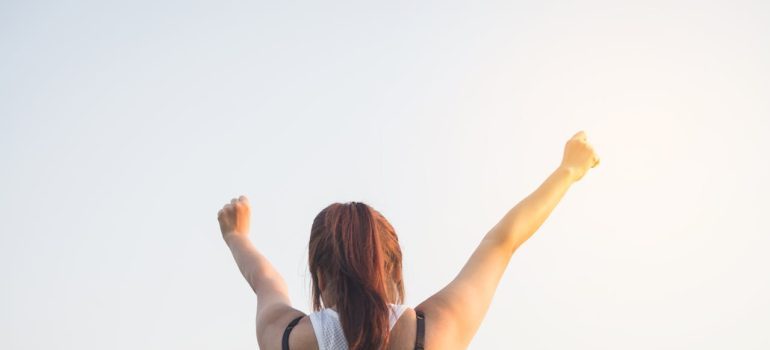 A woman with hands up