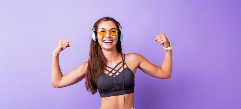 fit woman with hands up