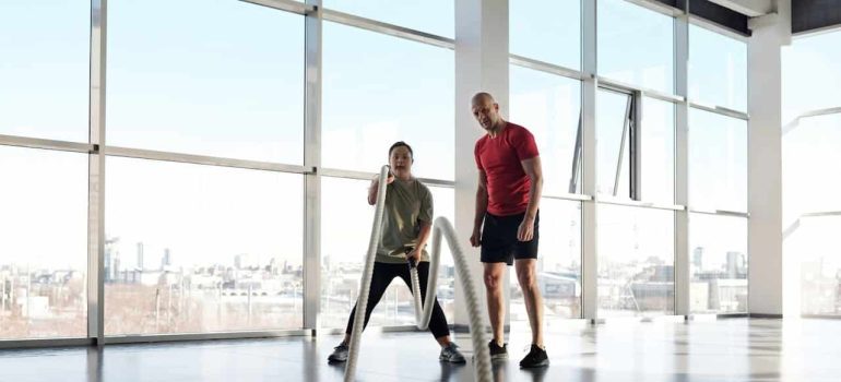 woman exercising with her personal trainer