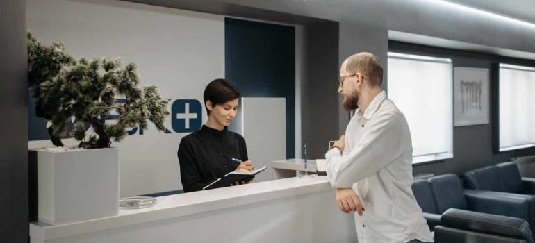 A man and woman talking in a hospital