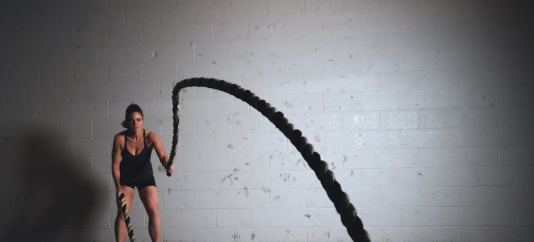 woman holding exercise rope
