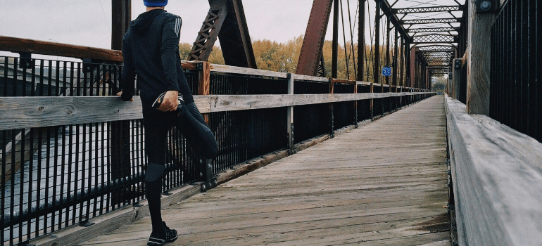 a man knowing the common running mistakes and how to fix them before starting your run