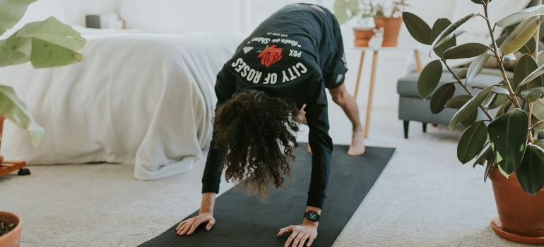 Person doing cardio workouts you can do without leaving your living room