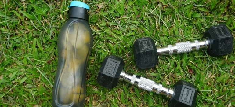 a bottle of water and two weighs
