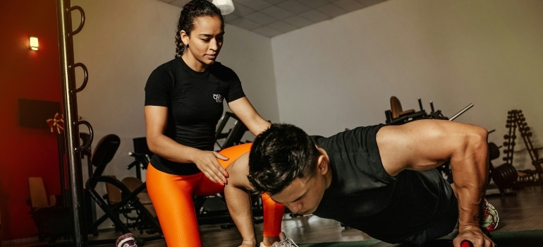 Person working out with a fitness trainer