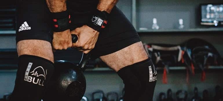 A man lifting a kettlebell