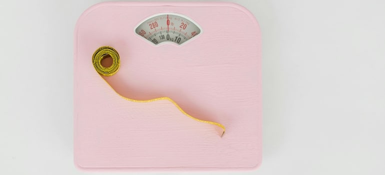 Measuring tape on a weighing scale symbolizing keto meal plan mistakes Dubai residents make