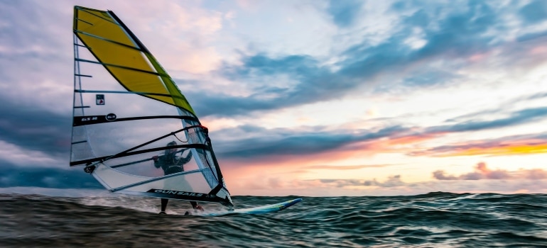 Person enjoying windsurfing Dubai offers 