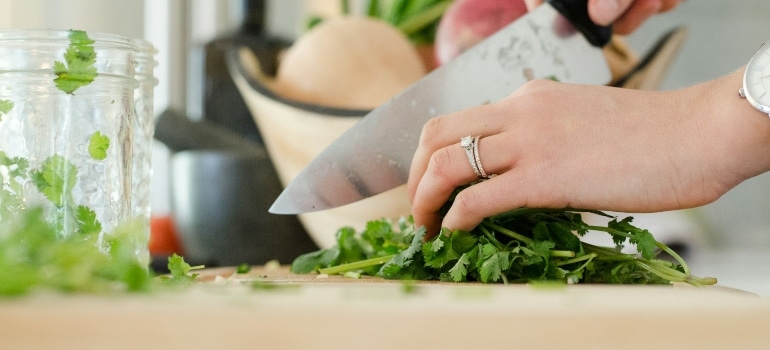 Person chopping herbs