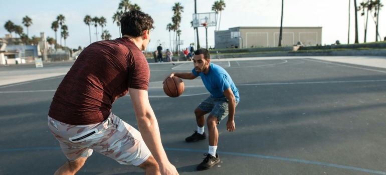 two boys playing basketball