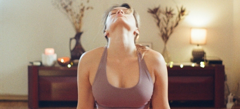 Person doing small evening habits that make morning workouts easier
